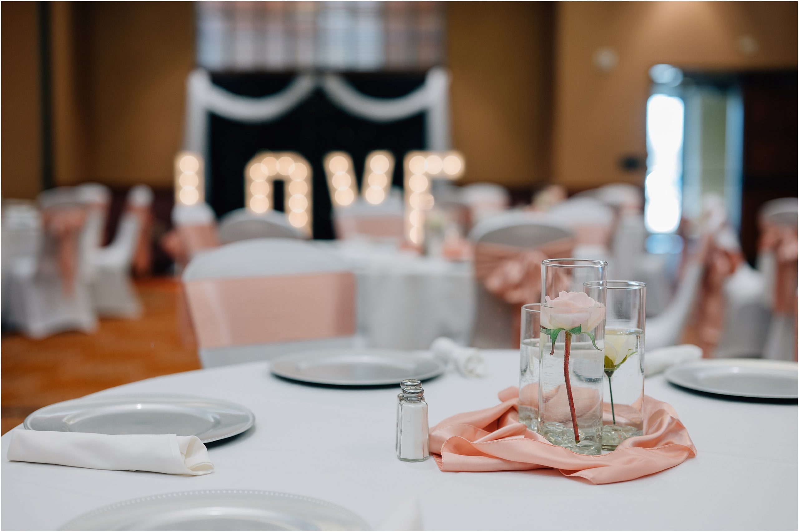 Blush and white wedding details at Honey Creek Resort by Omaha NE wedding photographer, Anna Brace. 