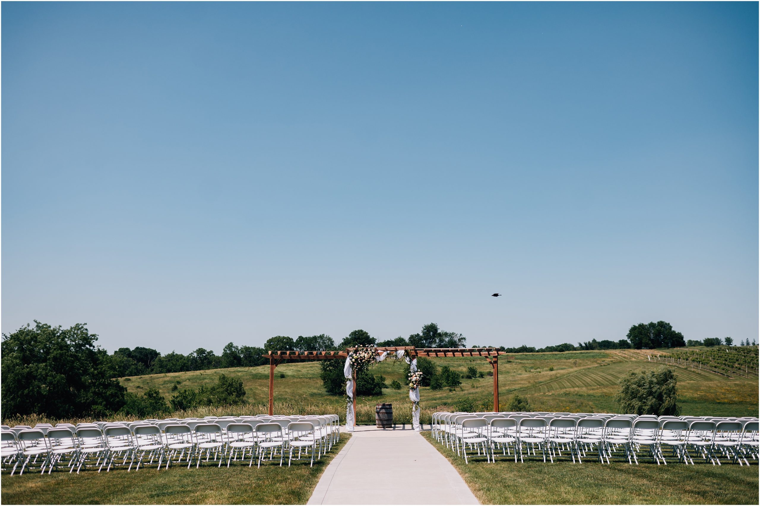 The outdoor ceremony space at Carper Vineyard and Winery, a Des Moines wedding venue. Photo by Anna Brace, an Omaha Wedding Photographer.
